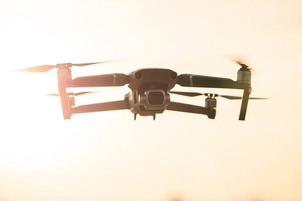 What are the benefits of using drones for filming real estate and commercial buildings