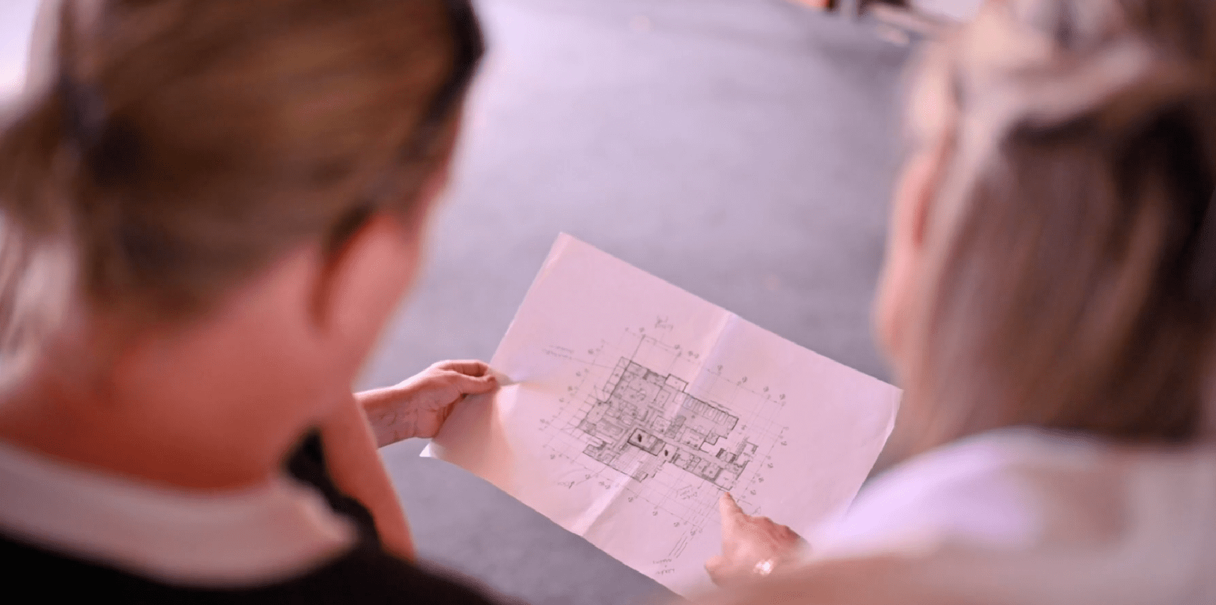 Looking Over Shoulder At Southland Charity Hospital Plans