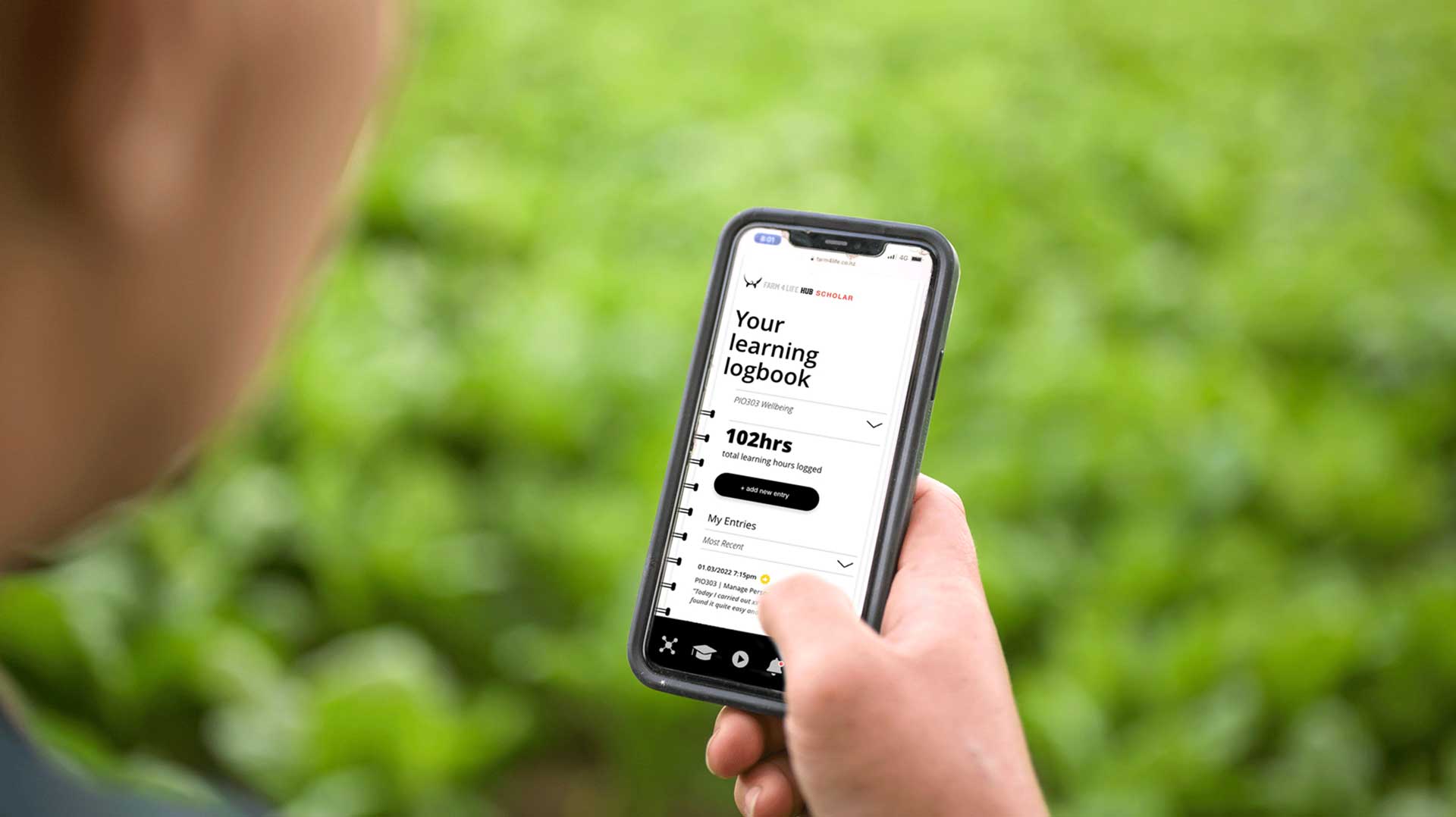 Image Of Farmer Holding The Phone With Farm 4 Life App Open