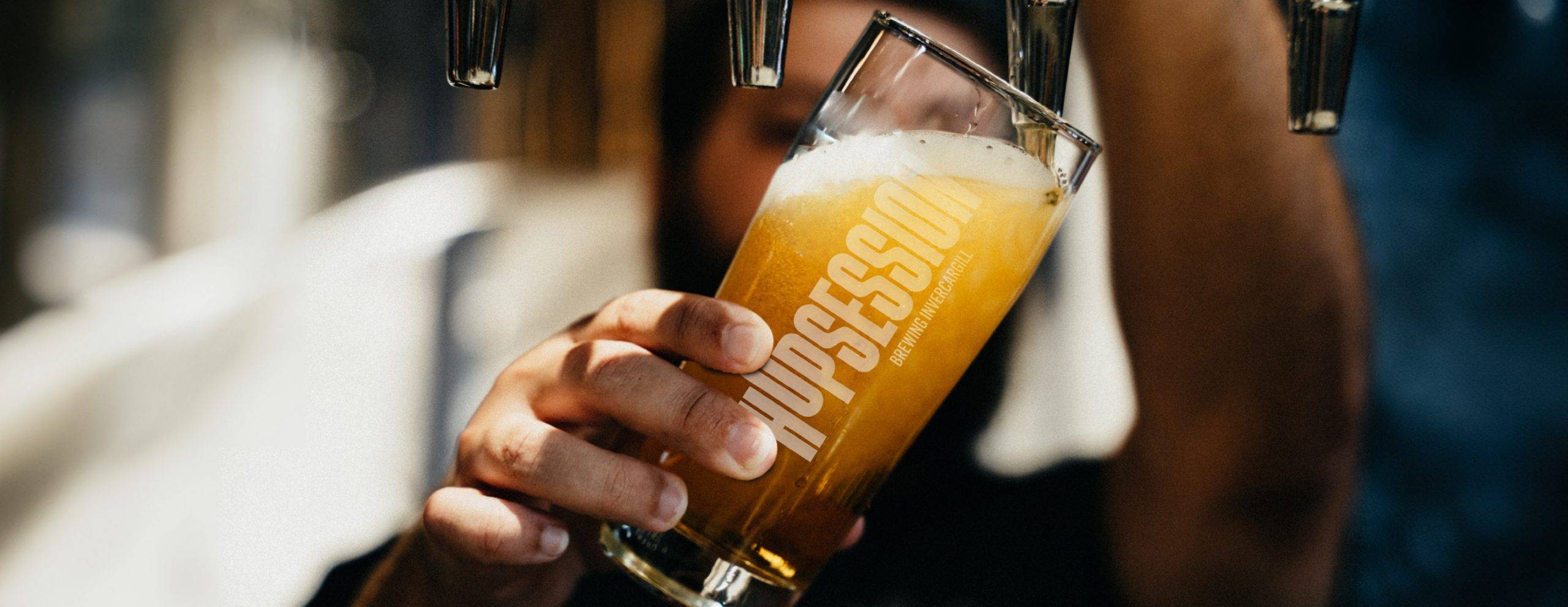 Hopsession Brewing Glass Being Filled With Craft Beer